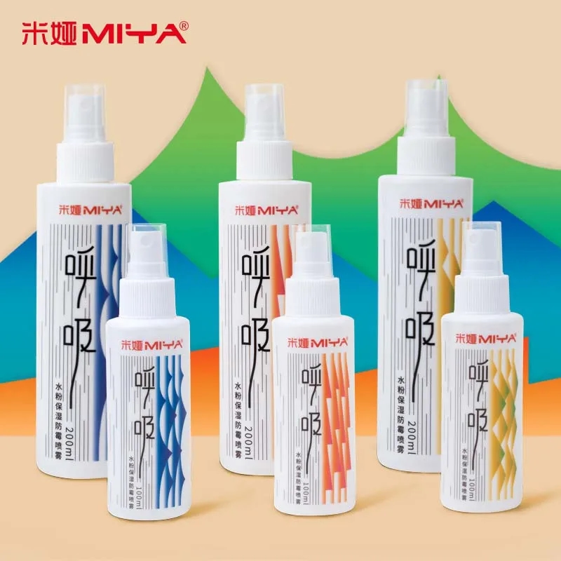 Close-up of a sprayer with Himi Moisture Spray, ready to be applied to watercolor paints