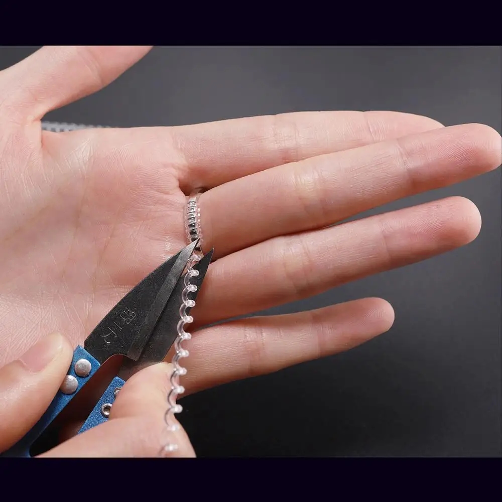 Silicone spiral adjuster, discreetly inserted into the ring to adjust the size