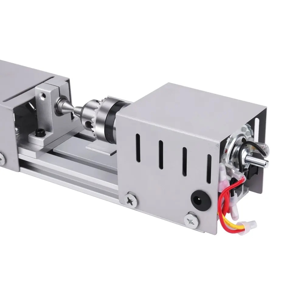 Mini lathe on the table with grinding wheels