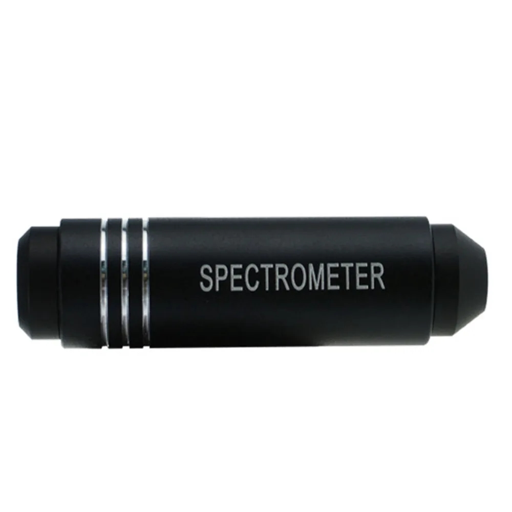 A person holding the spectroscope in their hand for evaluating precious stones
