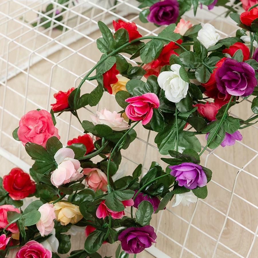 Artificial pink garlands decorating garden arches