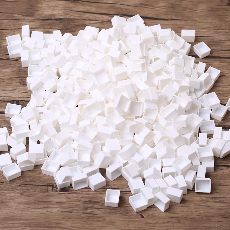 White mini-containers for watercolors, top view