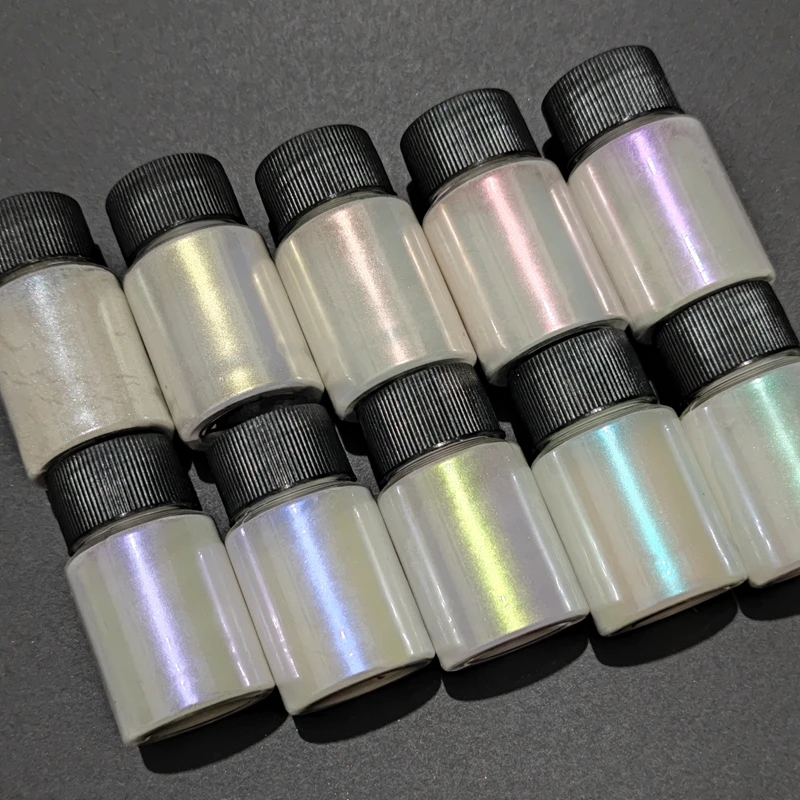 Pearlescent pigments scattered on a wooden surface