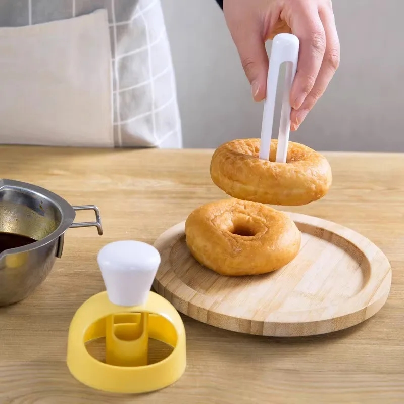Donut mold in use, demonstrating the process of preparing a delicious treat