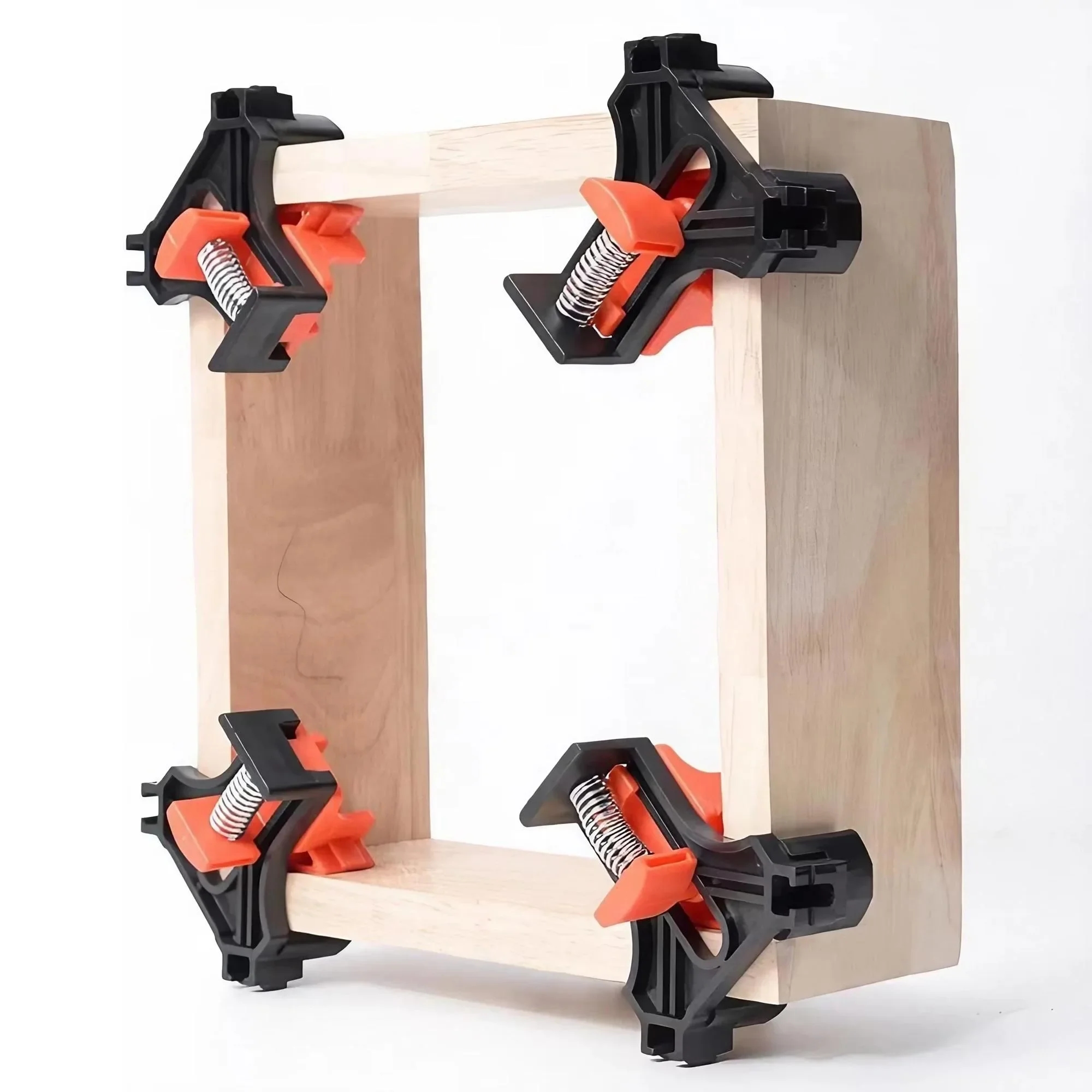 Corner clamps fixed on wooden parts during assembly
