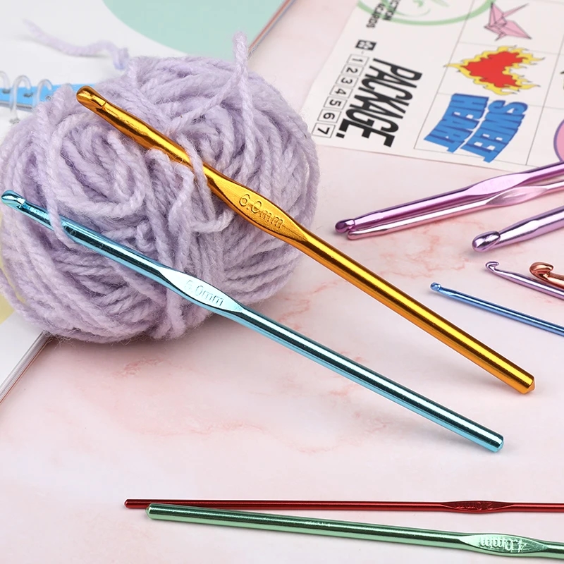 A woman's hands holding a hook and crocheting