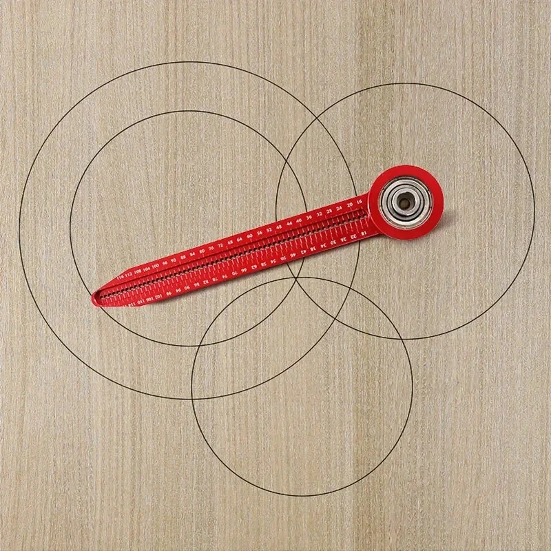 The result of using a compass-tape measure to create marking lines and circles on a wooden surface