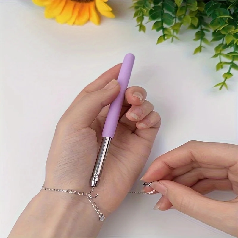 Photo of the device, demonstrating its use for fastening jewelry
