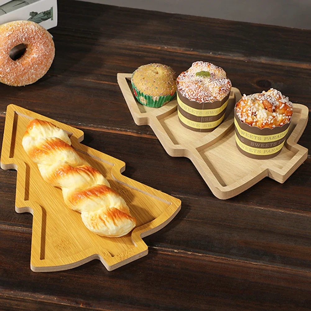 Christmas wooden tray with snacks and desserts on the holiday table