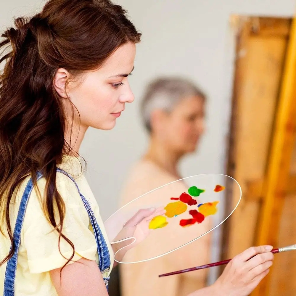 Photo of an artist working with an acrylic palette