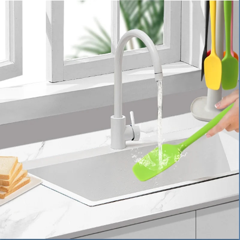Bright orange spatula that adds color to the cooking process