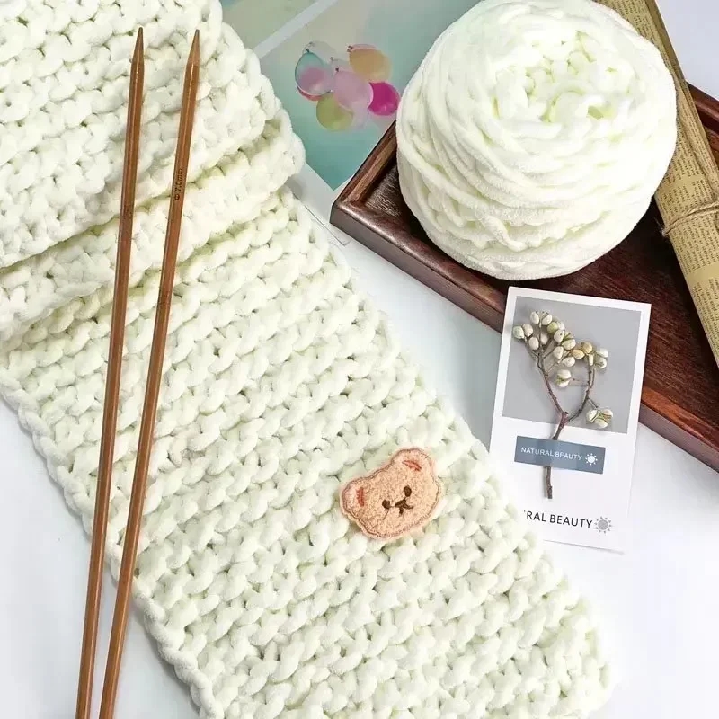 Hand touching skeins of soft and dense yarn for knitting