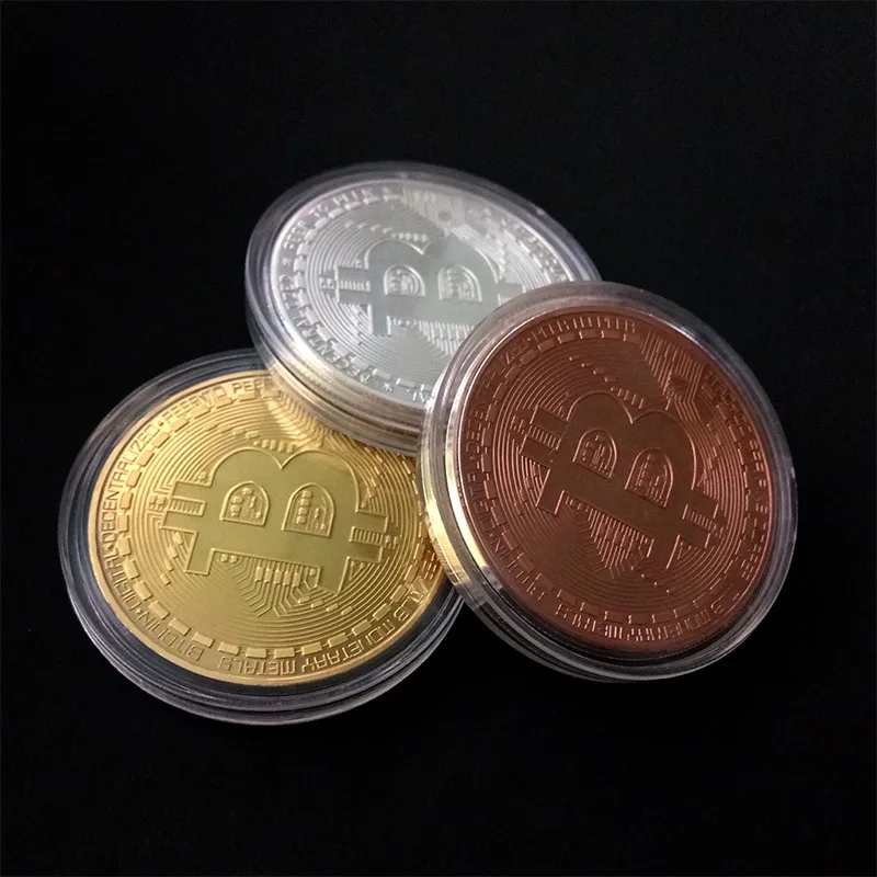 Demonstration of the size of the gold Bitcoin coin in the palm of the hand
