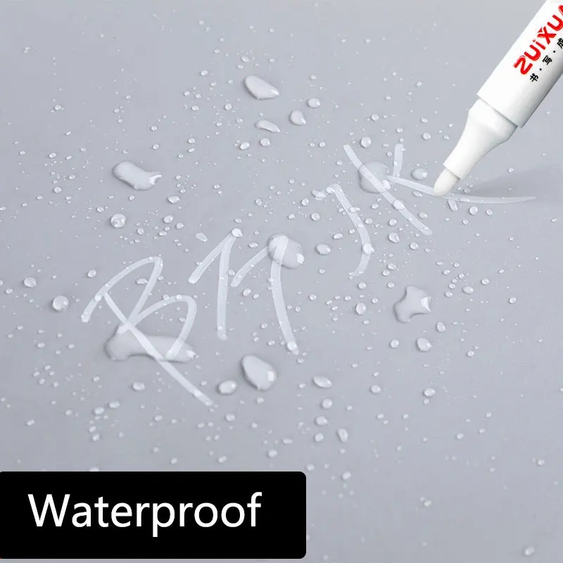 Pen writing on a metal surface, creating a bright and waterproof line