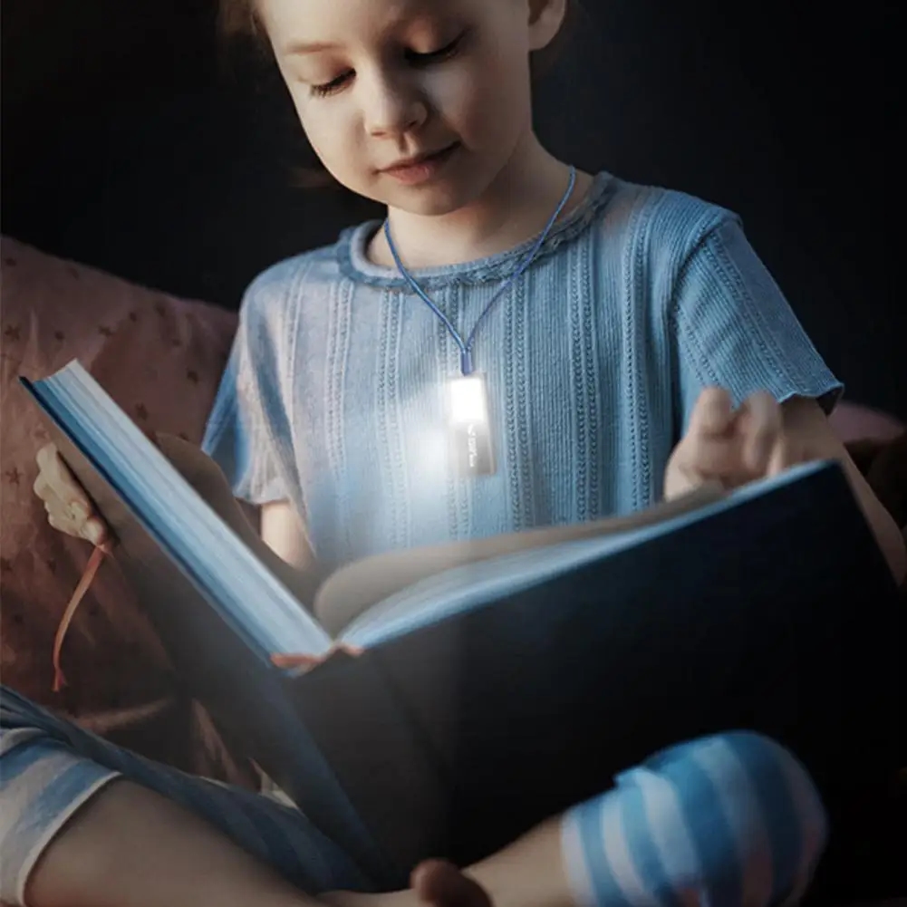 The flashlight is connected to a USB port for battery charging