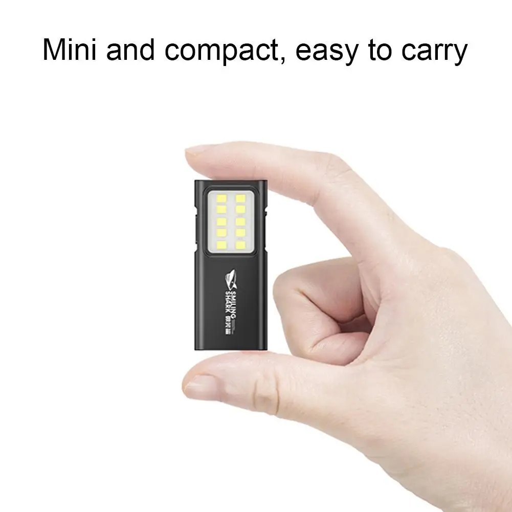 The flashlight is attached to the user's jacket using the clip
