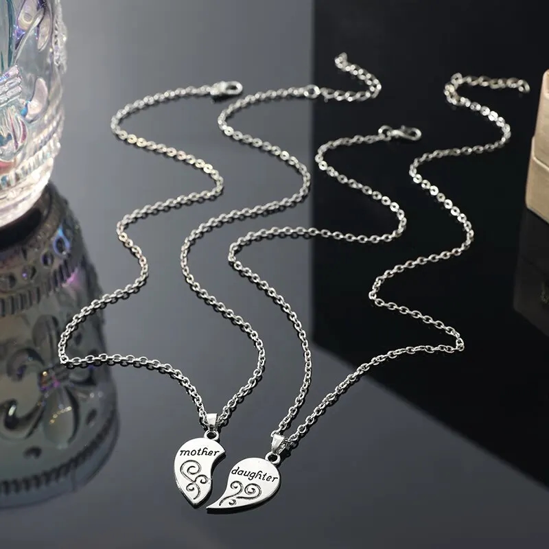 Set of two silver pendants of different sizes, symbolizing the closeness of mom and daughter