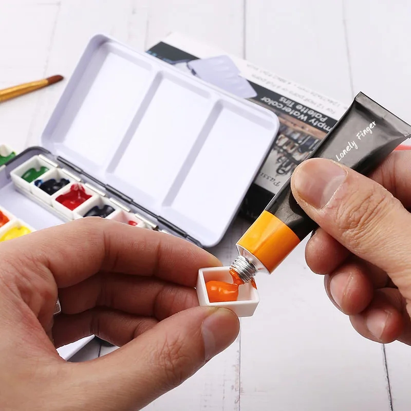 Metal watercolor palette with colorful removable half-pans