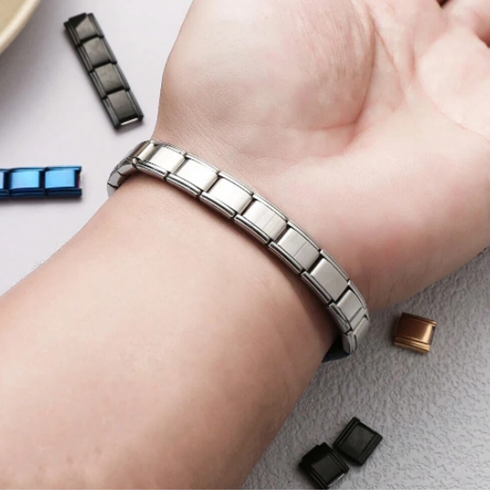Person using the opener tool to open a link in a charm bracelet