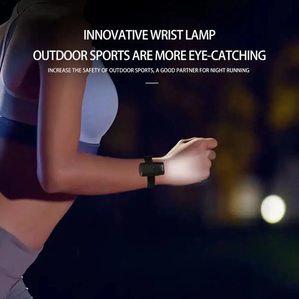 A person using the flashlight on their hand during a night bike ride
