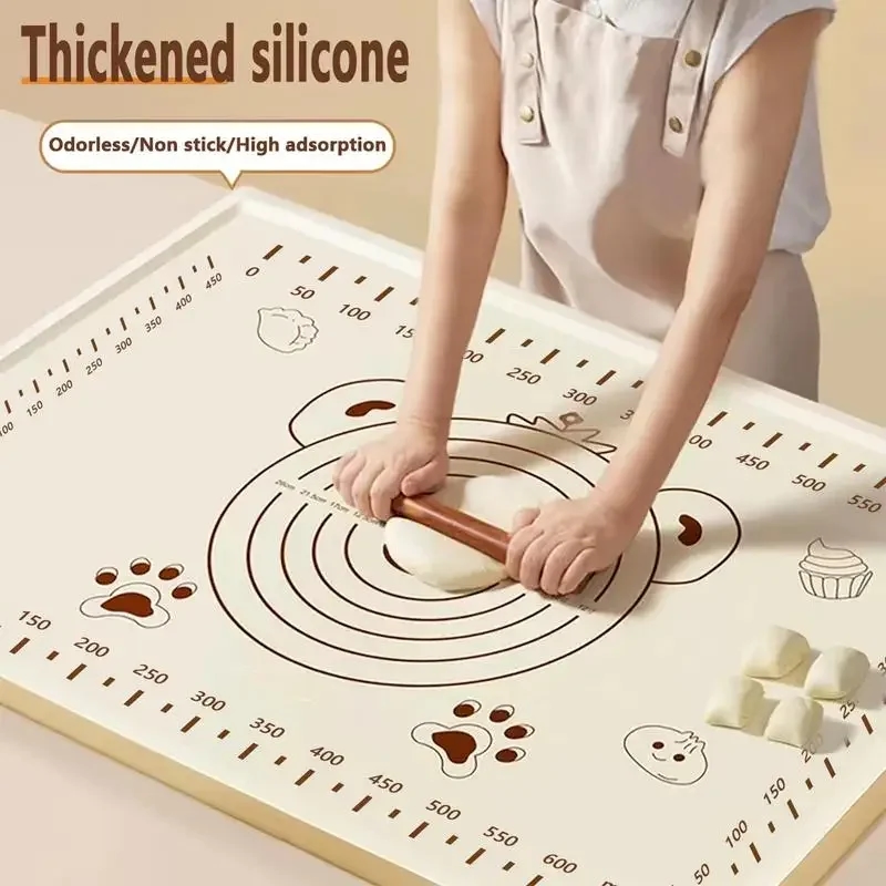 Silicone mat on the kitchen table with baked goods