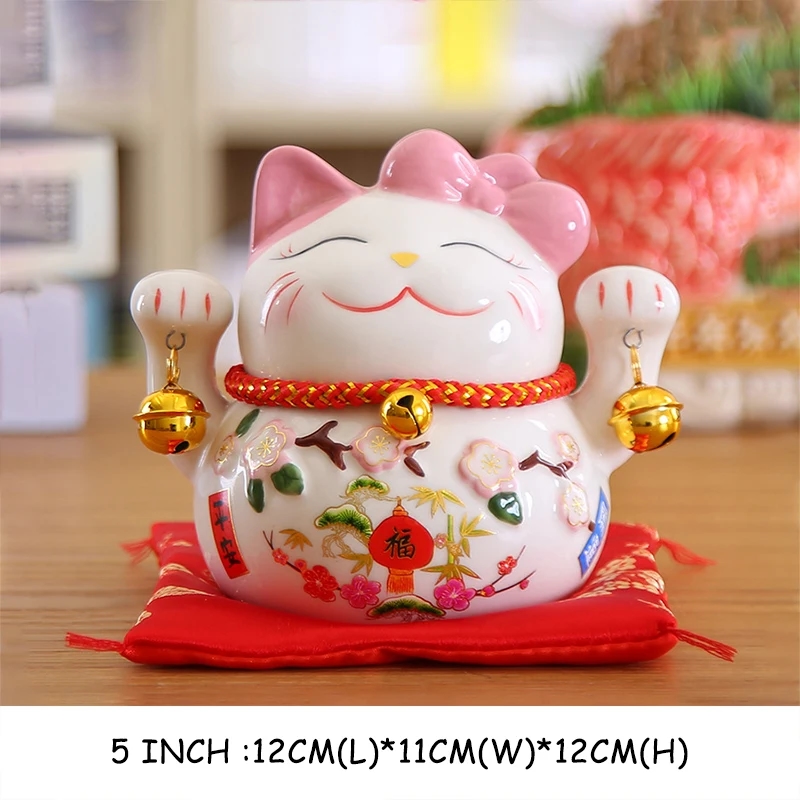 Ceramic figure of Maneki-neko Cat against the background of bookshelves