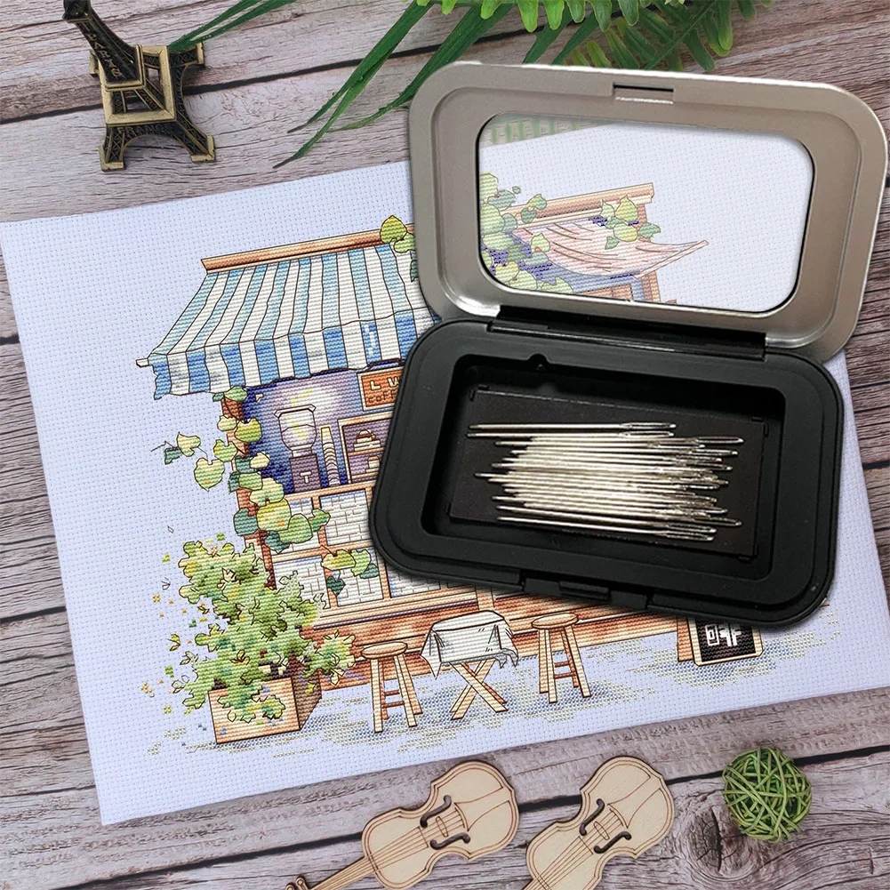 Vue de dessus de la boîte compacte avec fermeture pour ranger les accessoires de couture