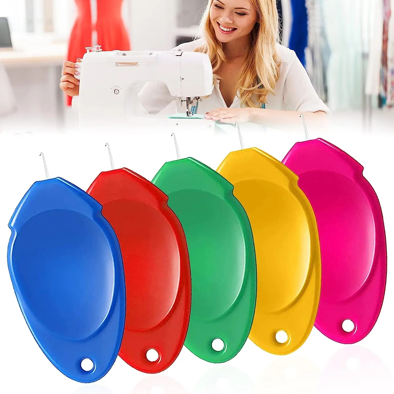 Close-up of automatic threaders of different colors lying on fabric