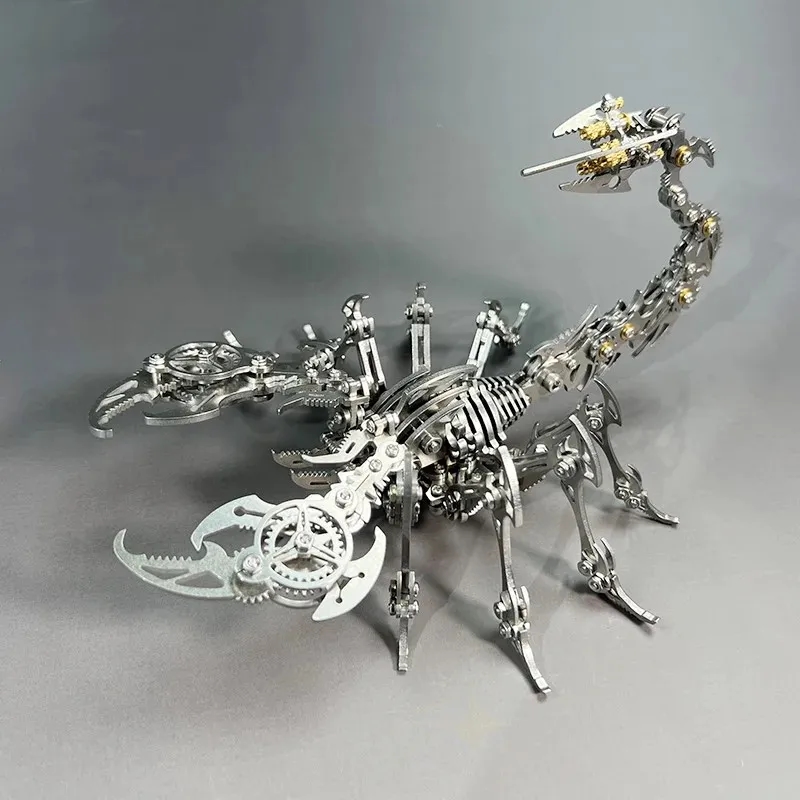 Assembled scorpion model against a background of metal parts