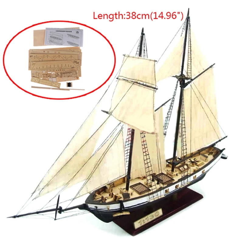 Eine Person montiert die Teile eines Holzmodells eines Segelschiffs