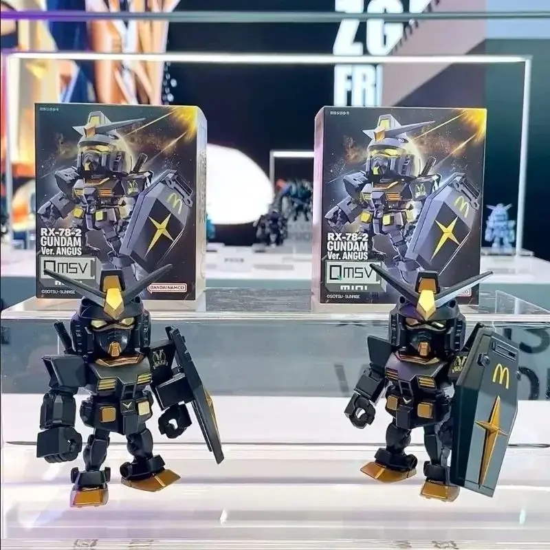 Photo of the Gundam McDonald's figurine set against its original box