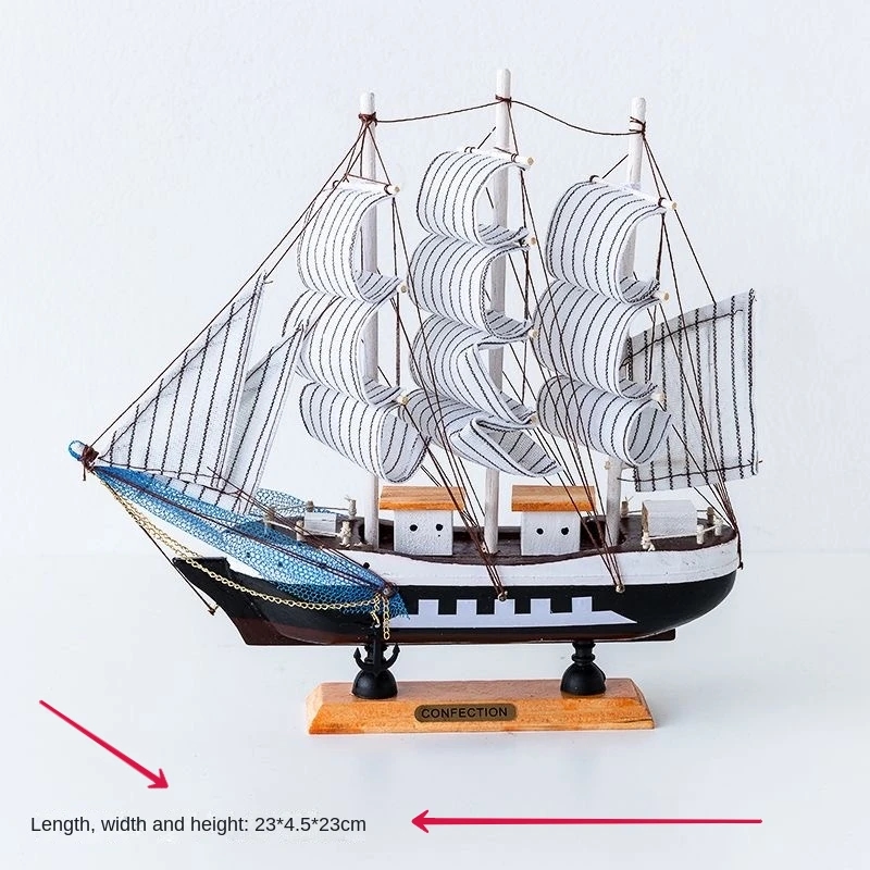 A wooden model of a sailboat stands on a windowsill