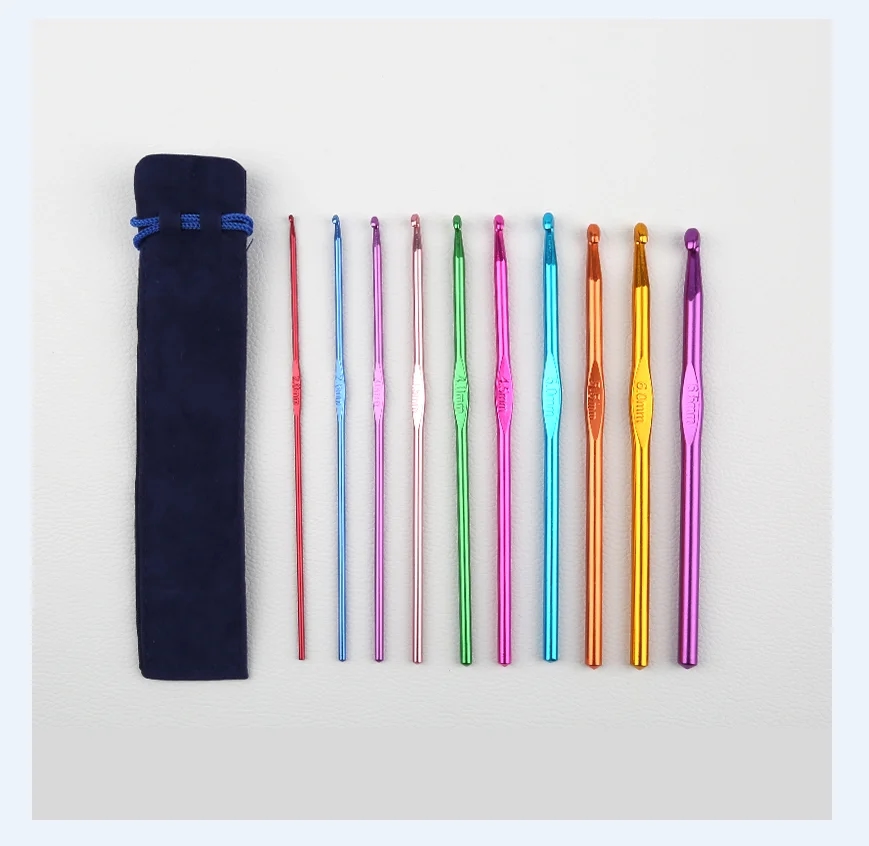 Hooks of different sizes in bright colors, lying on a white background