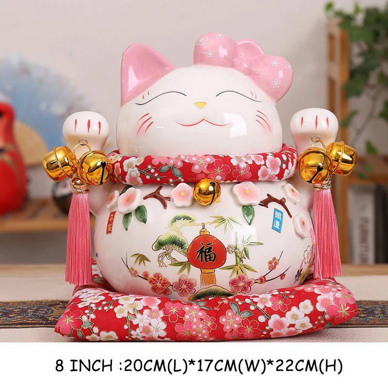 Ceramic figure of Maneki-neko Cat against a background of bamboo branches