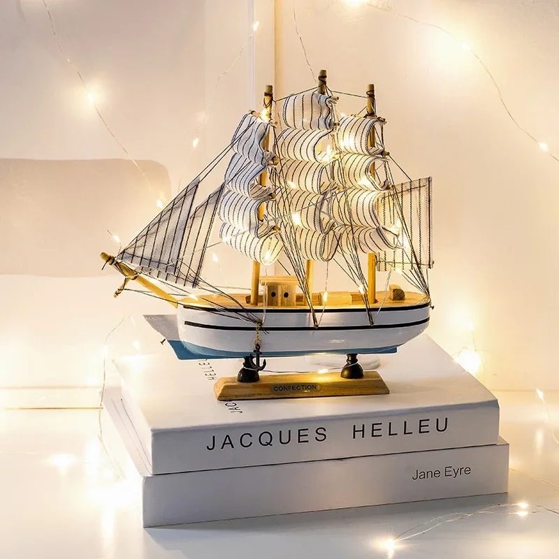 A beautiful wooden model of a sailing vessel stands on a shelf