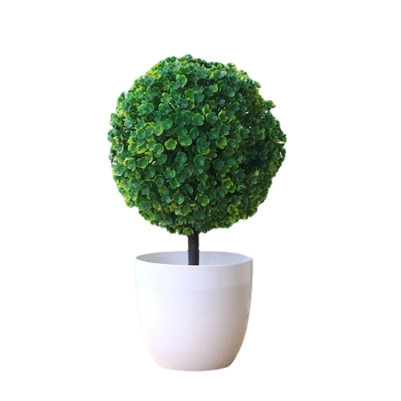 Artificial mini-tree with yellow leaves, suitable for creating a cozy atmosphere
