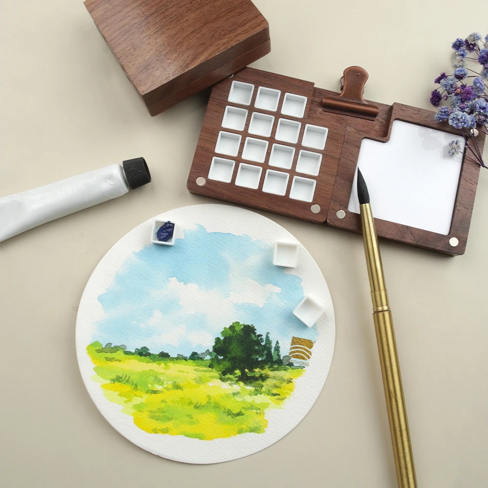Photo of a wooden painting palette with metallic decorative elements