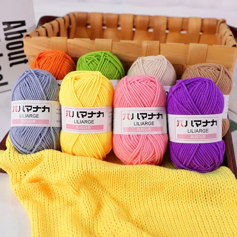 Close-up of a bright spool of soft cotton yarn for hand knitting