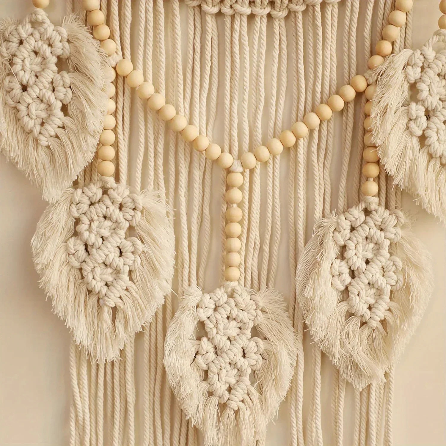 Details of the macrame dream catcher showing the quality of workmanship and style