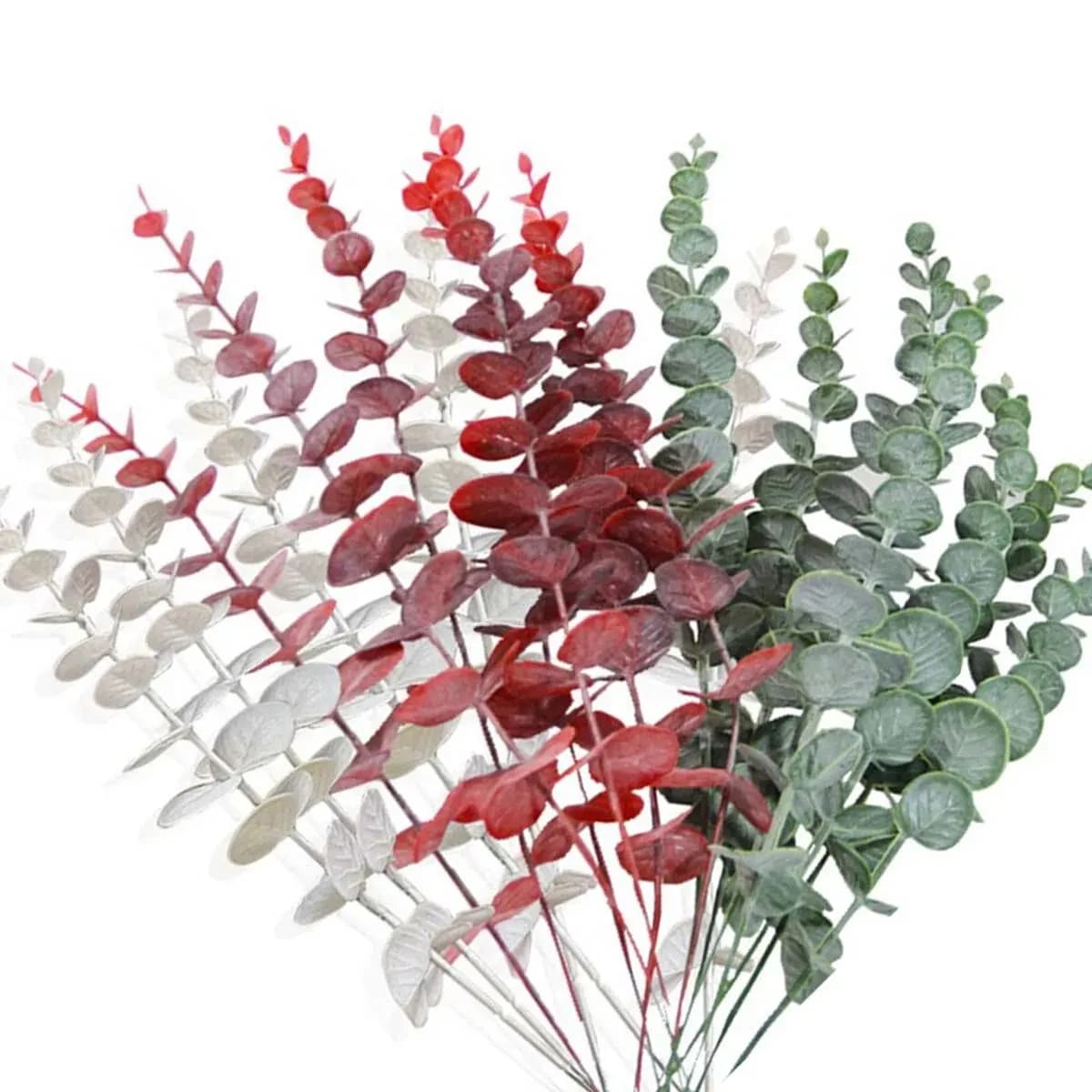 Set of artificial eucalyptus leaves placed on a wooden table
