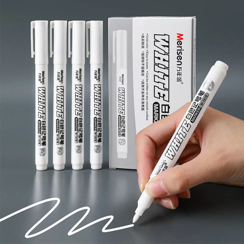 Image of a white marker leaving a trace on a wooden surface