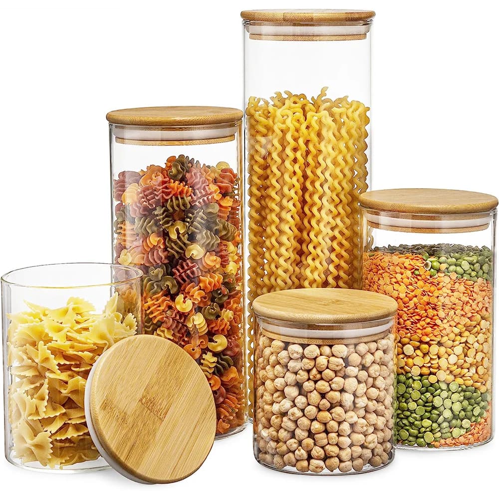 Image of a glass jar with a bamboo lid, filled with various dry goods